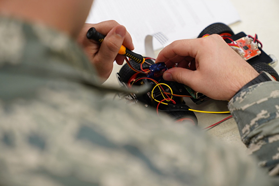 airmen working with wires and learning